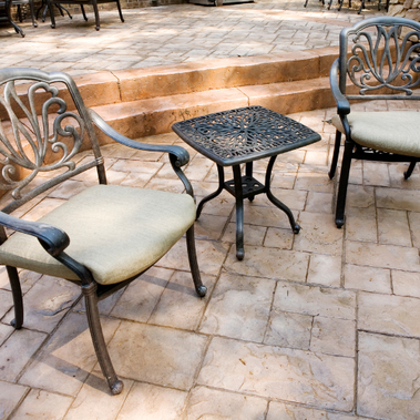 Picture of tiled patio with black iron furniture